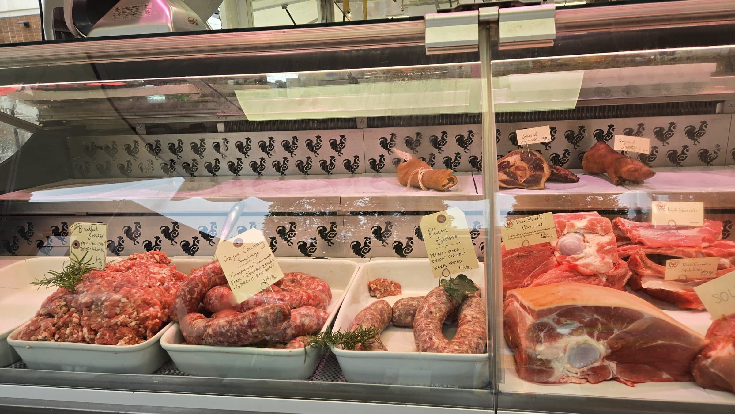 Ground meat, linked sausages, and pork cuts in the Sea Breeze Farm market case