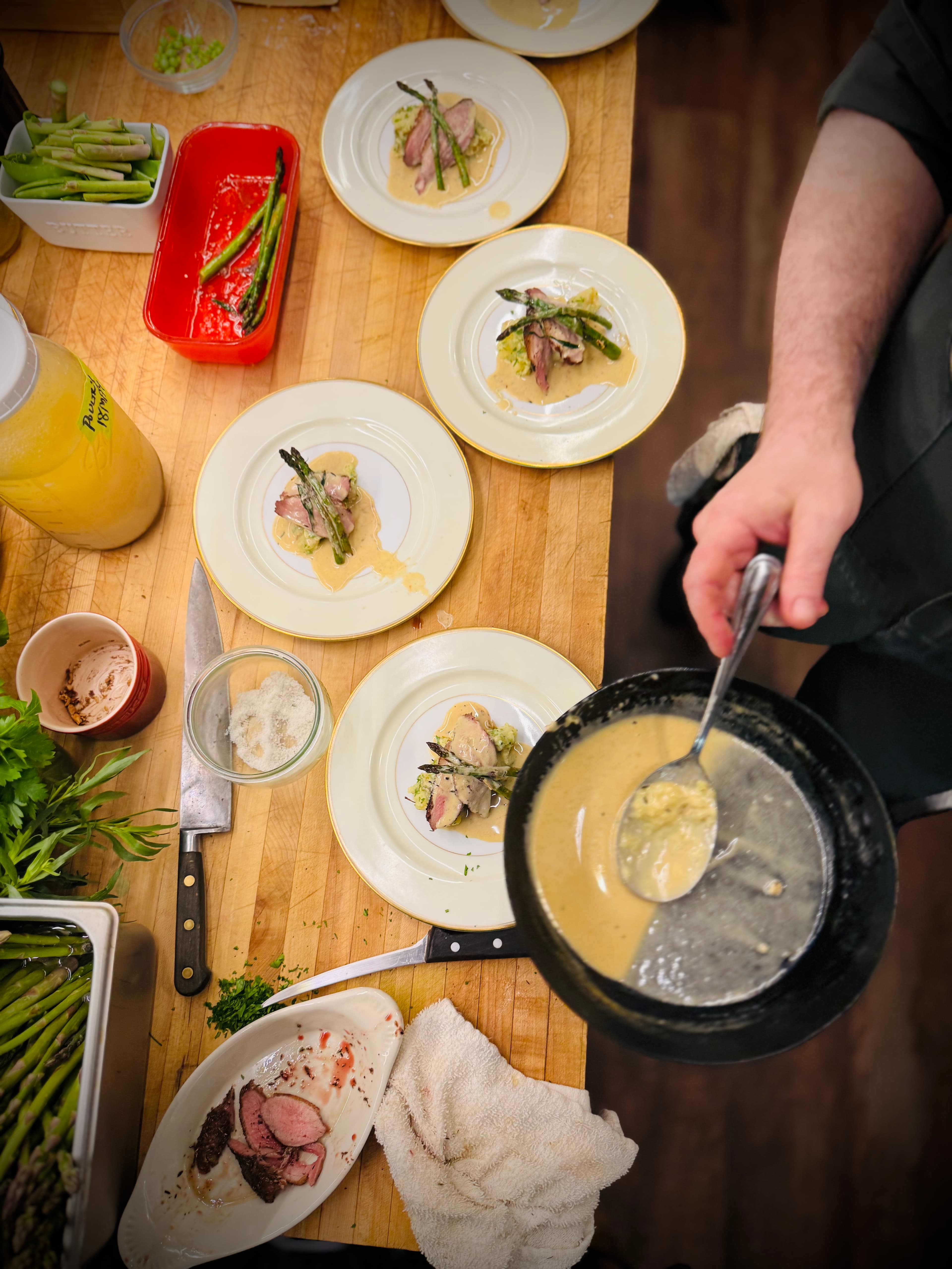 French butter enriched pan sauce over spring vegetables with magret de canard